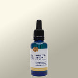 Facial serum bottle with dropper on a Light background