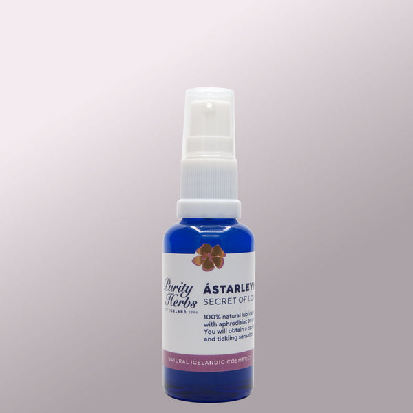 Purity Herbs Ástarleynd in Blue spray bottle with white label on a light purple background