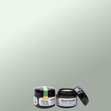 Two Jars, one open of Kraftaverk - Viking Balm on a light grey background
