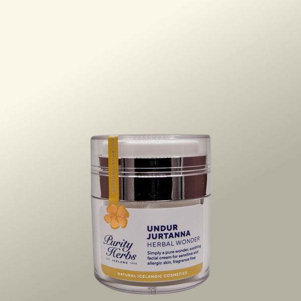 Cosmetic jar labeled 'Undur Jurtanna' by Purity Herbs on a light gray background